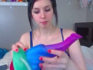 Little freak sucks on a fake huge cock